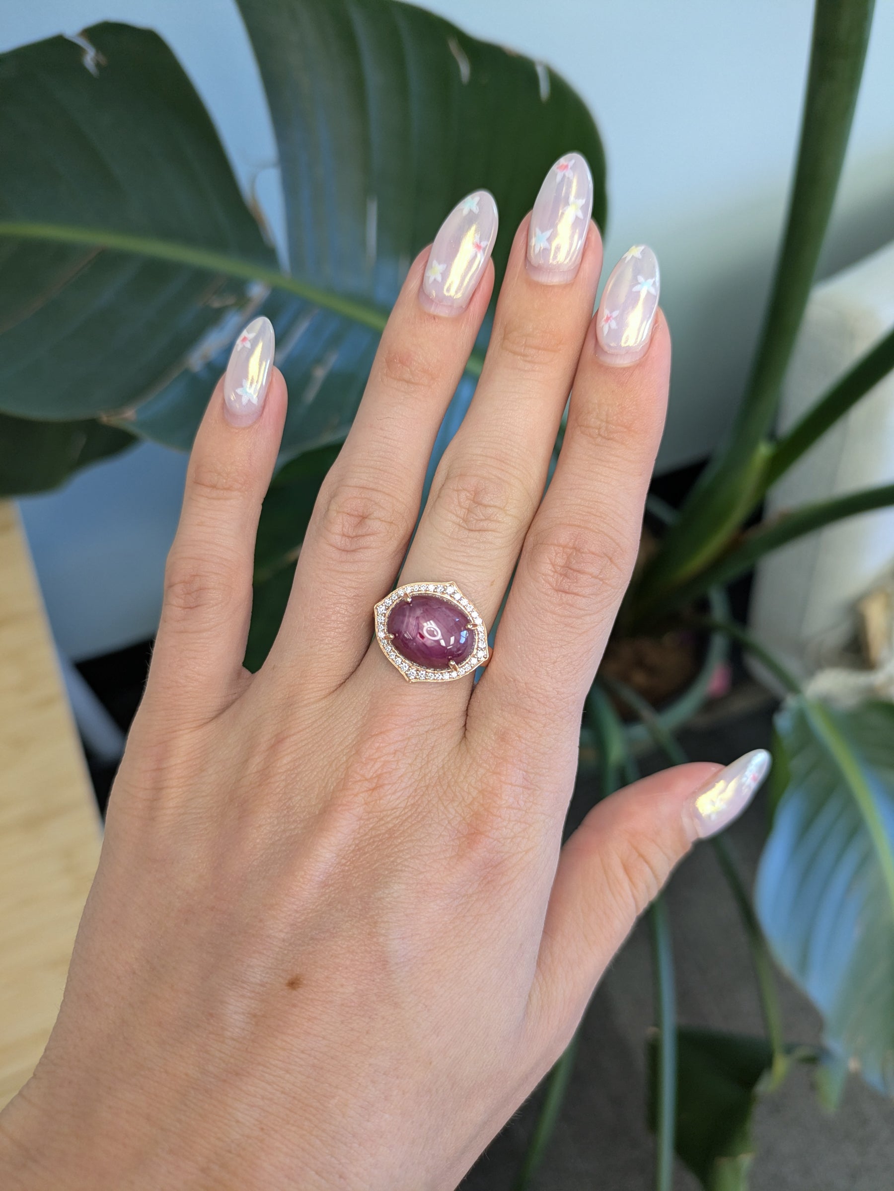 14K rose gold star ruby cabochon ring with diamond halo
