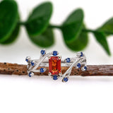 Varsha 14K Solid White Gold Orange Sapphire and Blue Sapphire Ring | EM 6x4mm