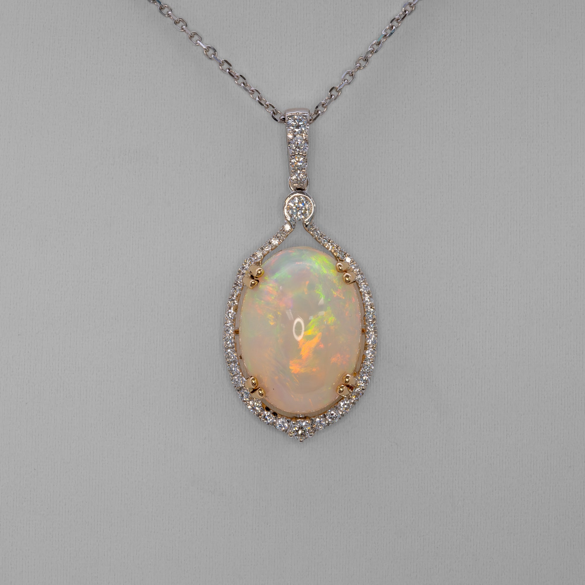 14K white & yellow gold ethiopian opal pendant with diamond accents