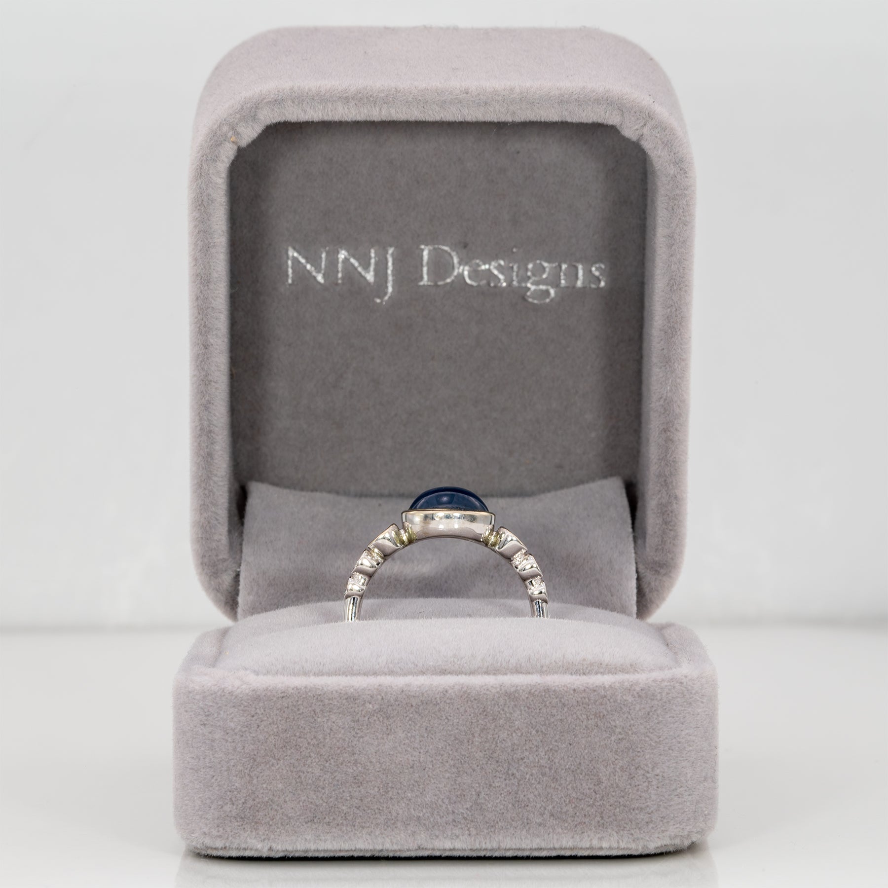 14K white gold blue star sapphire cabochon ring with diamonds