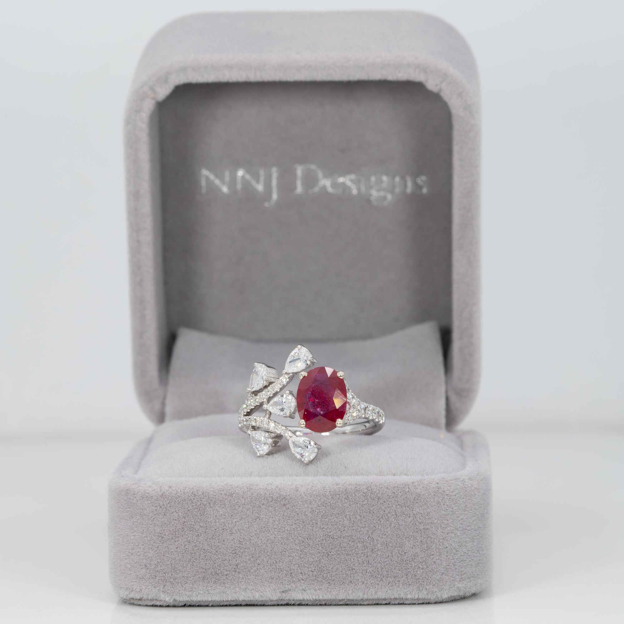 14K white gold mozambique ruby ring with diamond accents