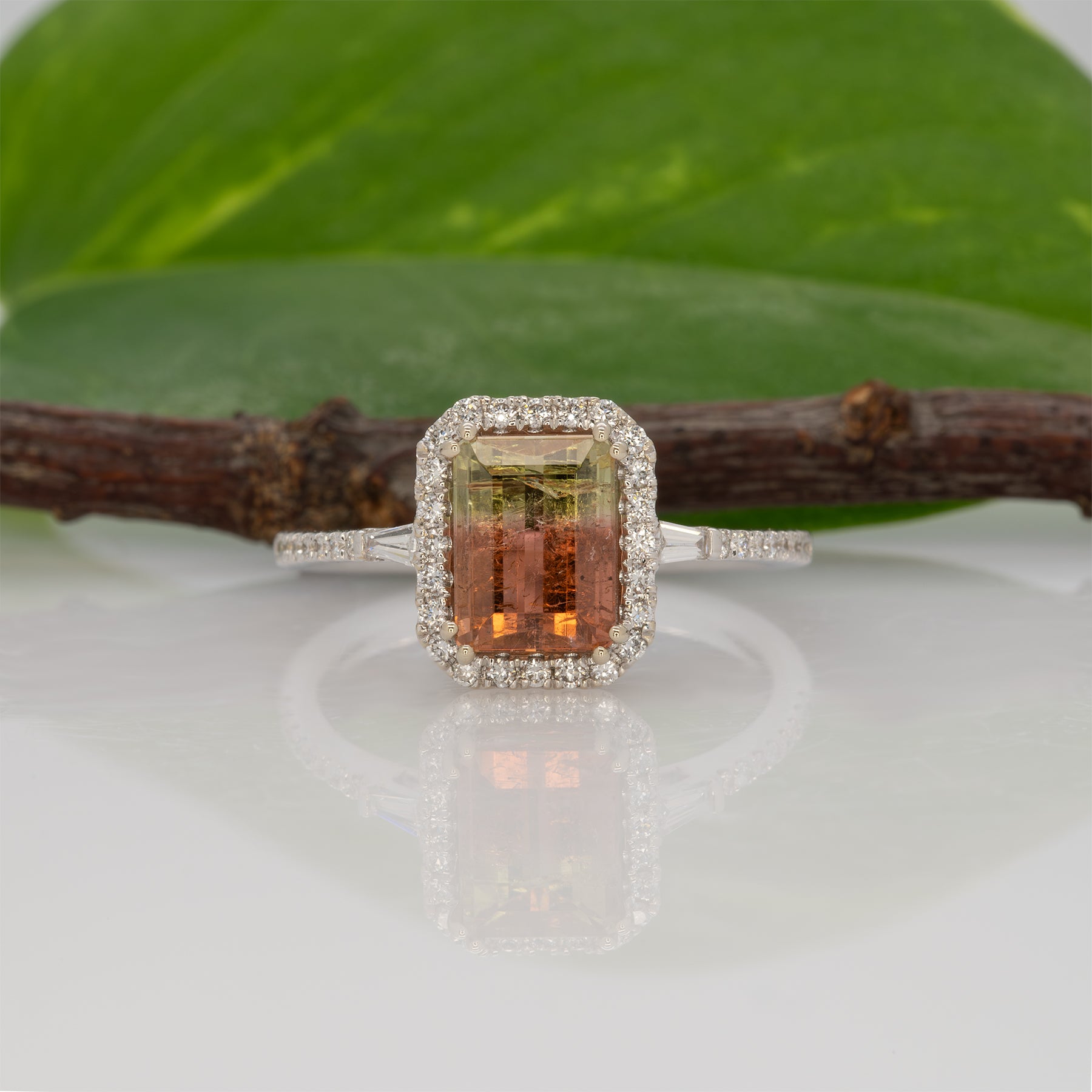 14K white gold bi-color tourmaline emerald-cut ring with diamond halo