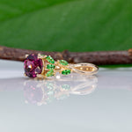 14K yellow gold purple garnet ring with tsavorite accents