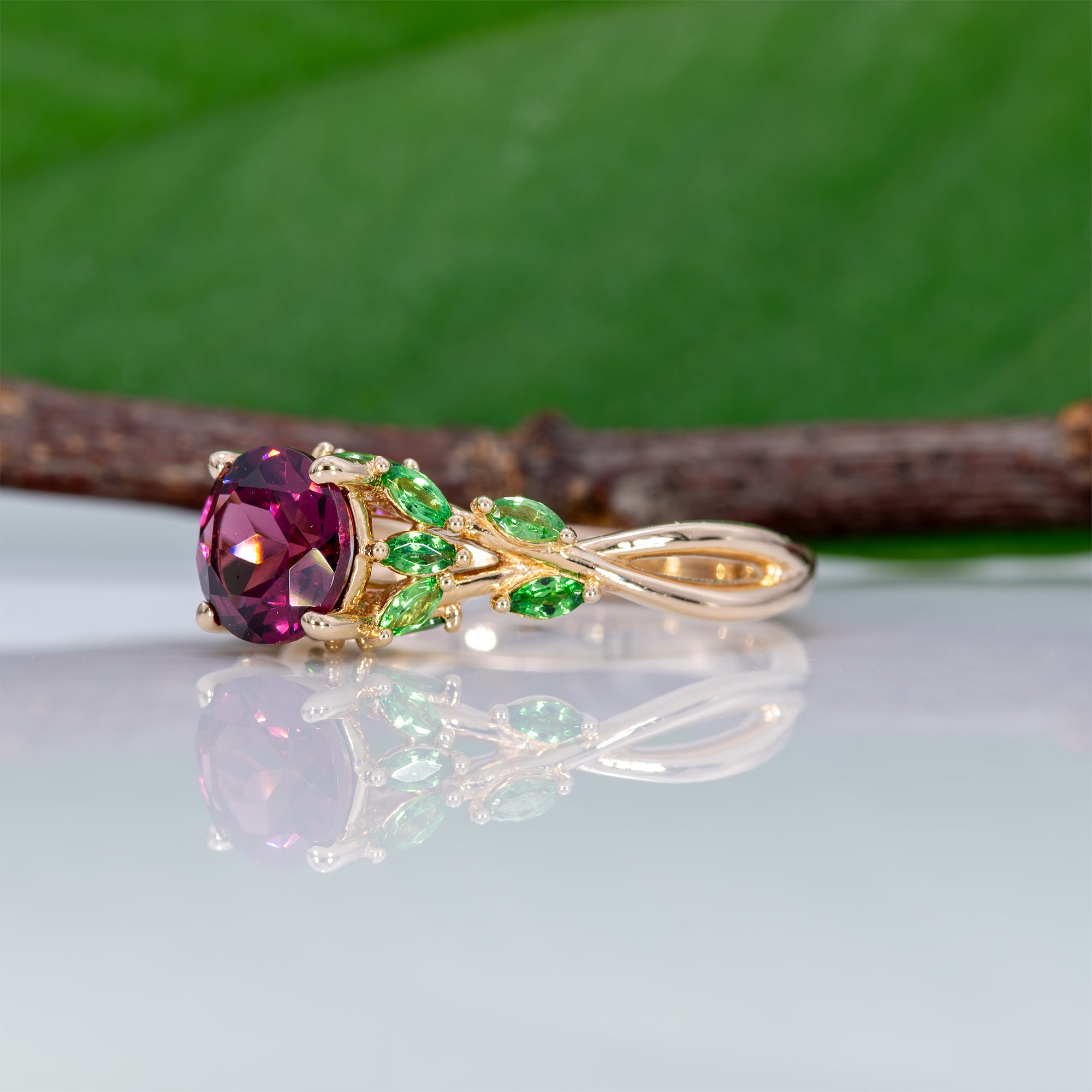 14K yellow gold purple garnet ring with tsavorite accents