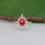 14K yellow gold padparadscha sapphire ring with diamond accents
