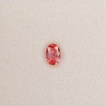 0.63 carat natural padparadscha sapphire, oval 6.2x4.2mm pink-orange loose gemstone