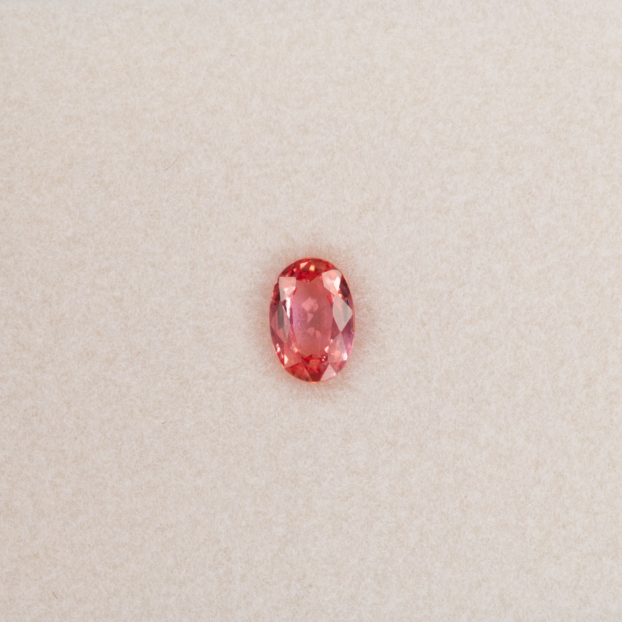 0.63 carat natural padparadscha sapphire, oval 6.2x4.2mm pink-orange loose gemstone
