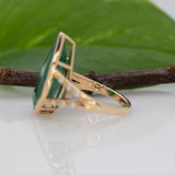 14K yellow gold Zambian emerald pear ring with diamond accents