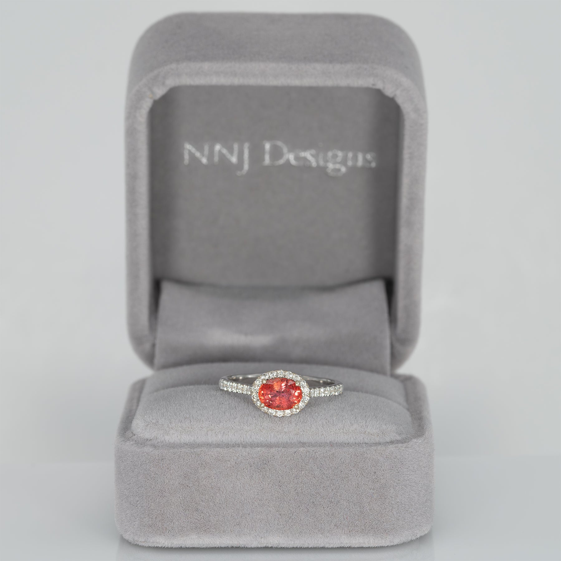 14K white gold padparadscha sapphire oval ring with diamond halo