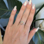 14K white gold bi-color tourmaline emerald-cut ring with diamond halo