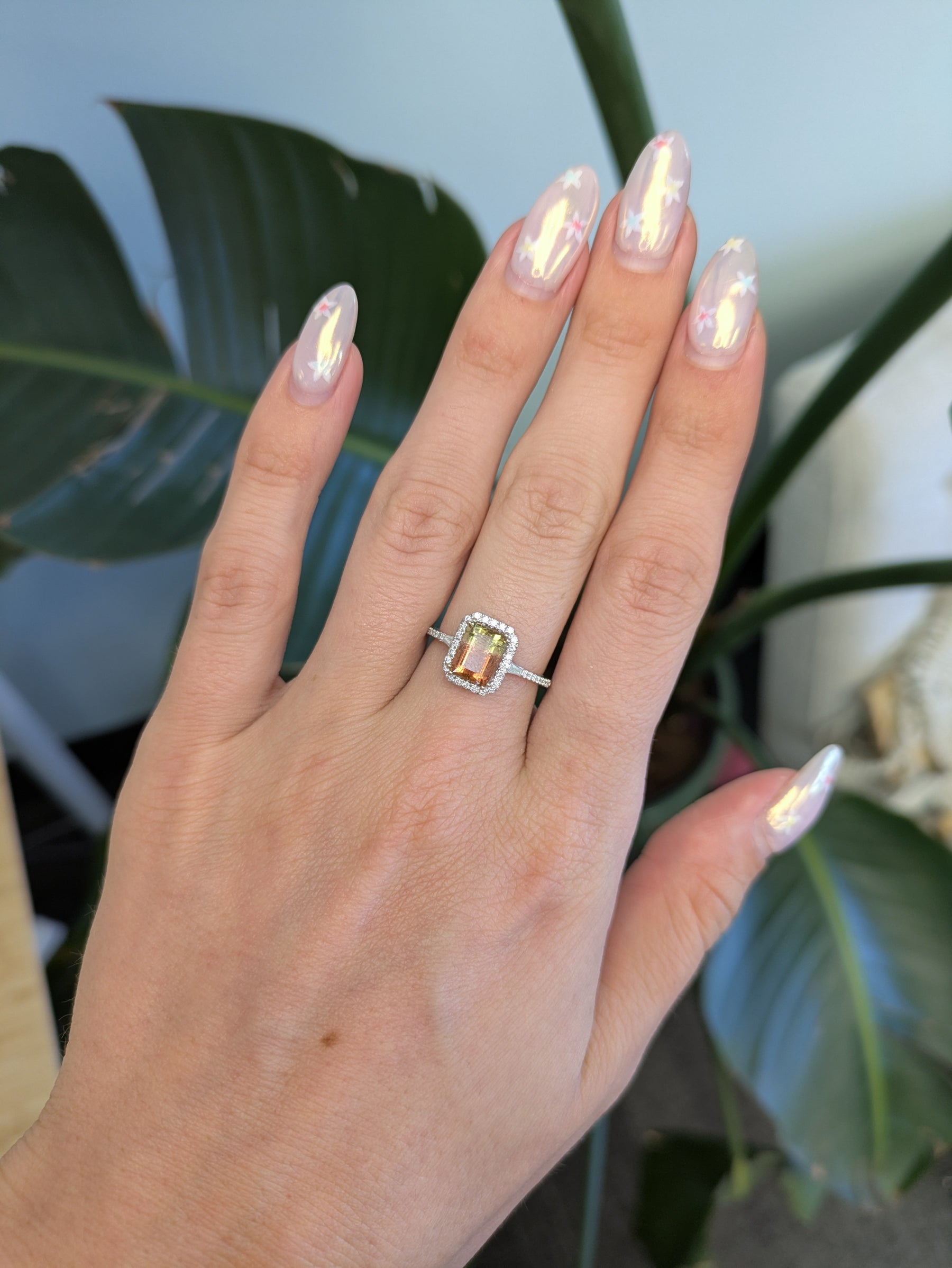 14K white gold bi-color tourmaline emerald-cut ring with diamond halo