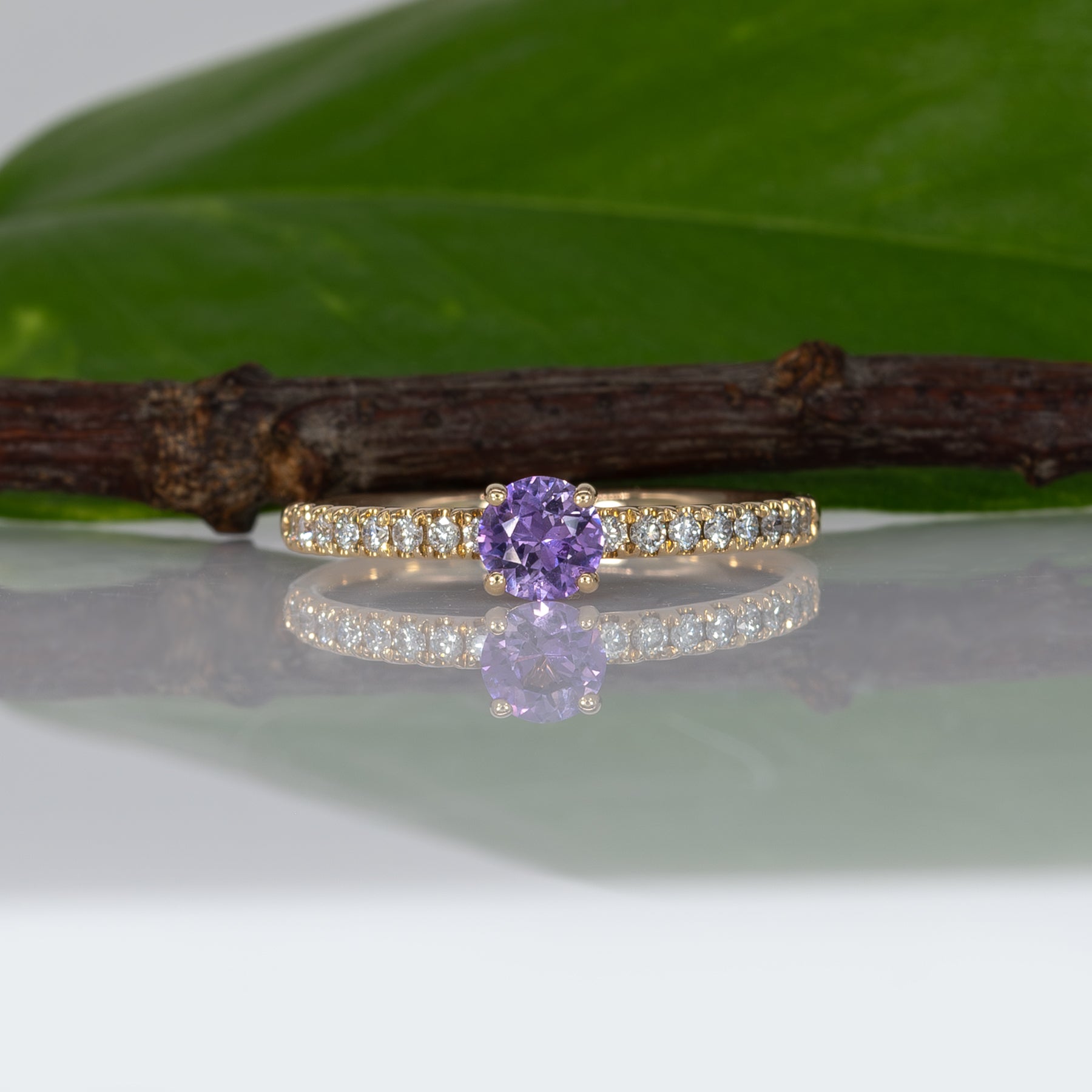 14K yellow gold purple sapphire round ring with diamond halo