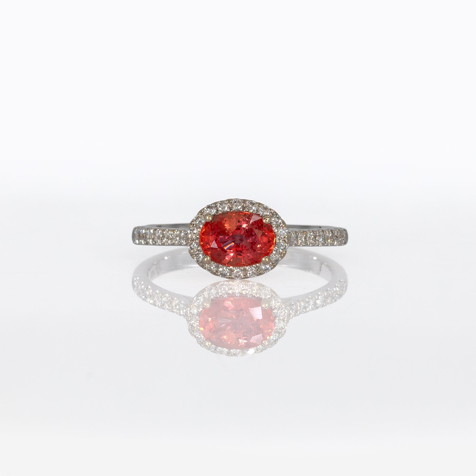 14K white gold padparadscha sapphire oval ring with diamond halo