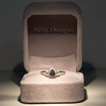 14K white gold pear alexandrite ring with diamond halo