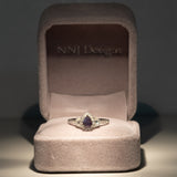 14K white gold pear alexandrite ring with diamond halo