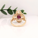 Celtic Inspired Woven Diamond Halo Ring Design with a Heated Ruby in Solid 14k Yellow Gold
