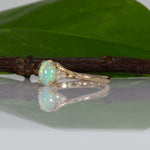 14K yellow gold Ethiopian opal cabochon ring with diamond accents