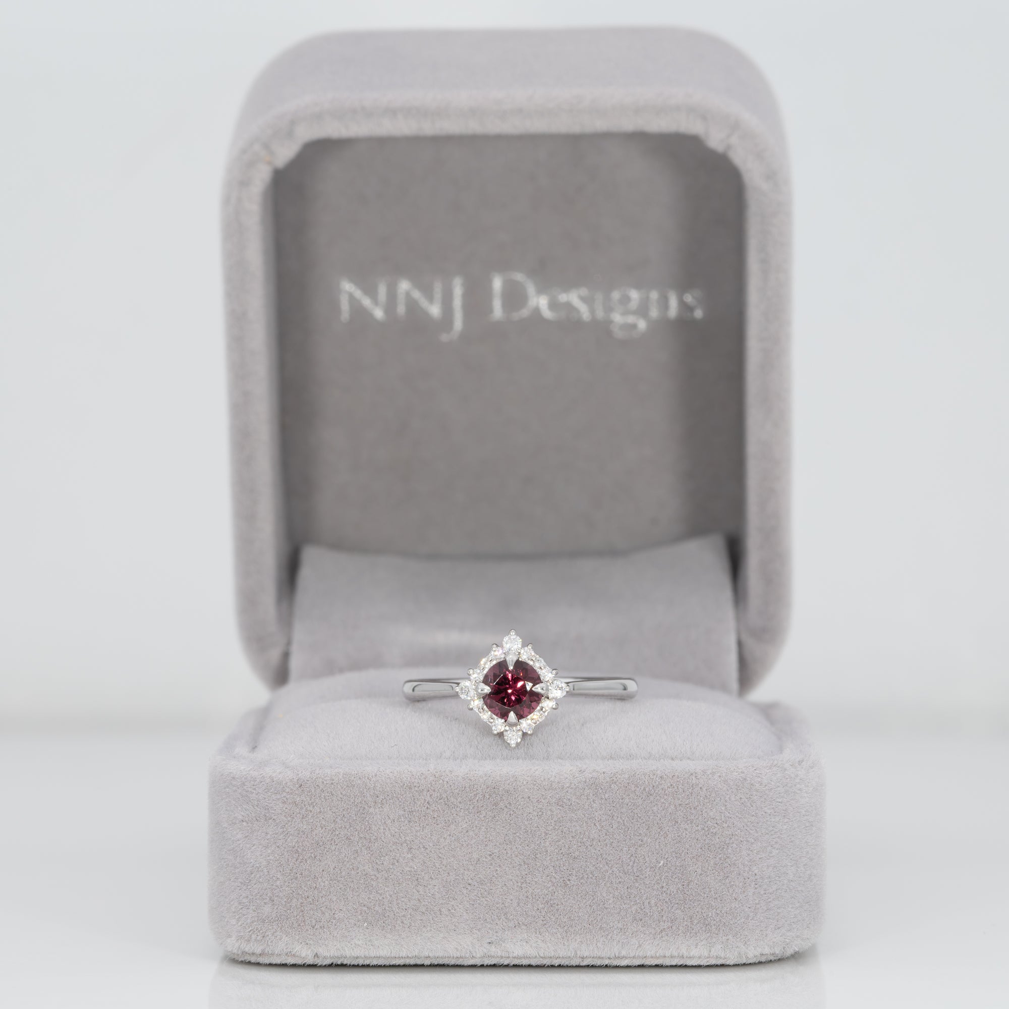 14K white gold red spinel ring with diamond halo