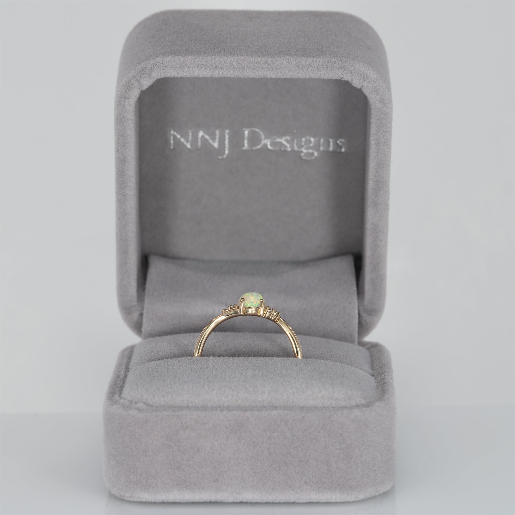 14K yellow gold Ethiopian opal cabochon ring with diamond accents