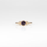 14K yellow gold bezel-set purple spinel ring with diamond accents