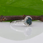 14K white gold teal sapphire oval ring with diamond halo