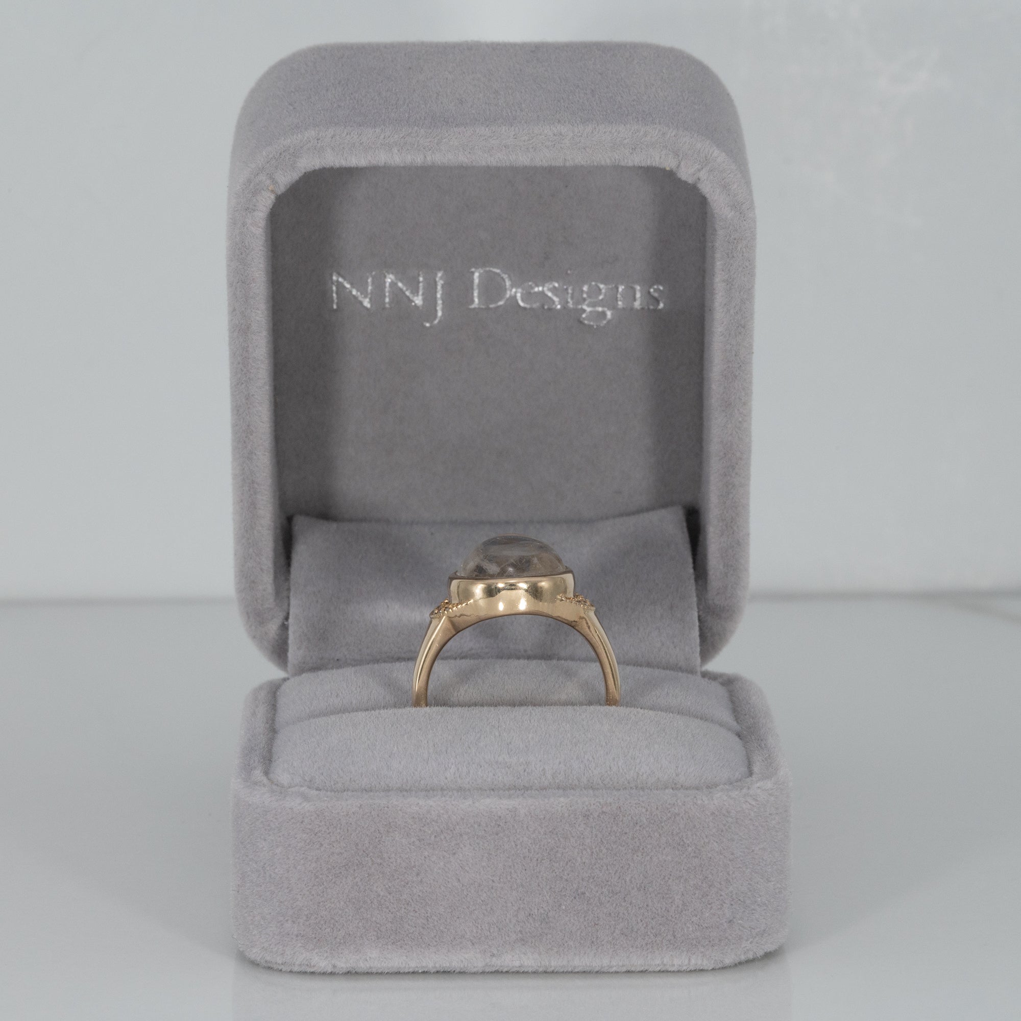14K yellow gold rainbow moonstone cabochon ring with diamonds