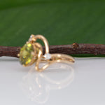 14K yellow gold sphene ring with diamond halo