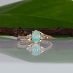14K yellow gold Ethiopian opal cabochon ring with diamond accents