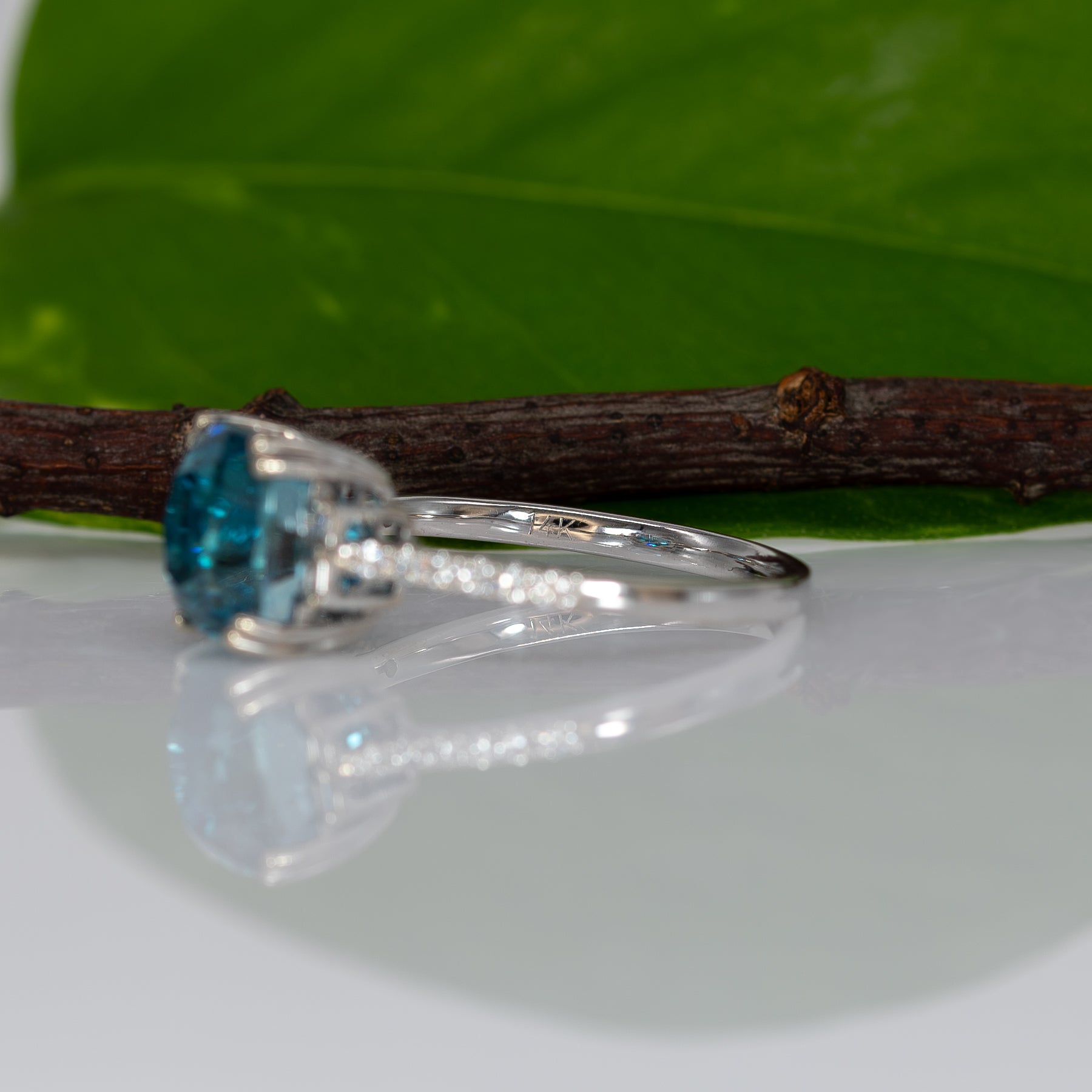 14K white gold Cambodian blue zircon cushion ring with diamond accents