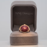 14K rose gold star ruby cabochon ring with diamond halo