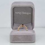14K yellow gold red spinel ring with diamond accents