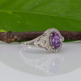 14K white gold pink sapphire oval ring with diamond halo