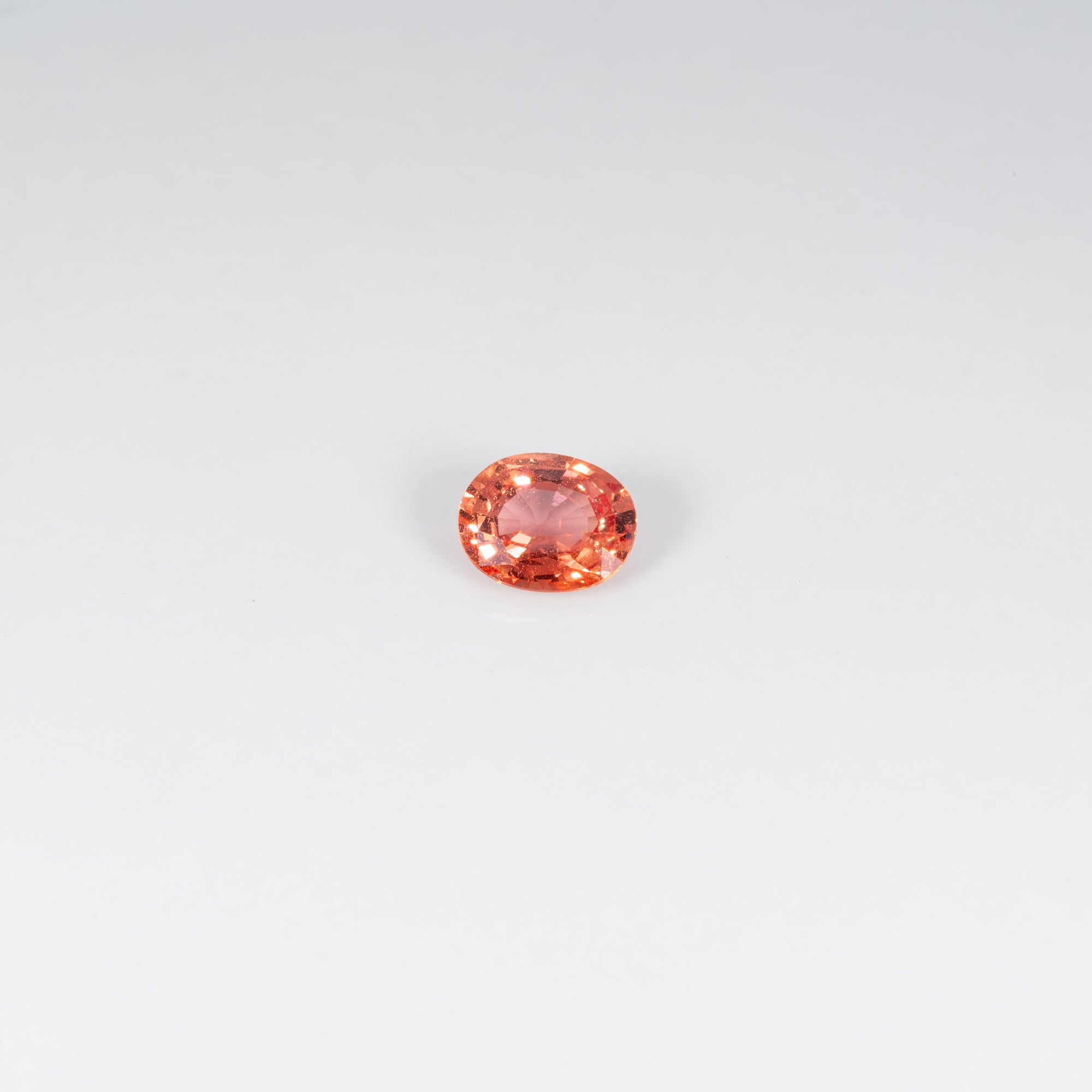 1.25 carat natural padparadscha sapphire, oval 7.4x6mm pink-orange loose gemstone
