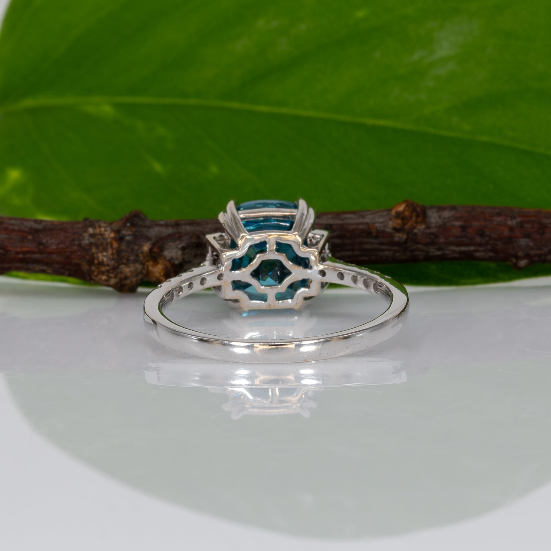 14K white gold Cambodian blue zircon cushion ring with diamond accents