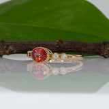 14K yellow gold padparadscha sapphire oval ring with diamond accents