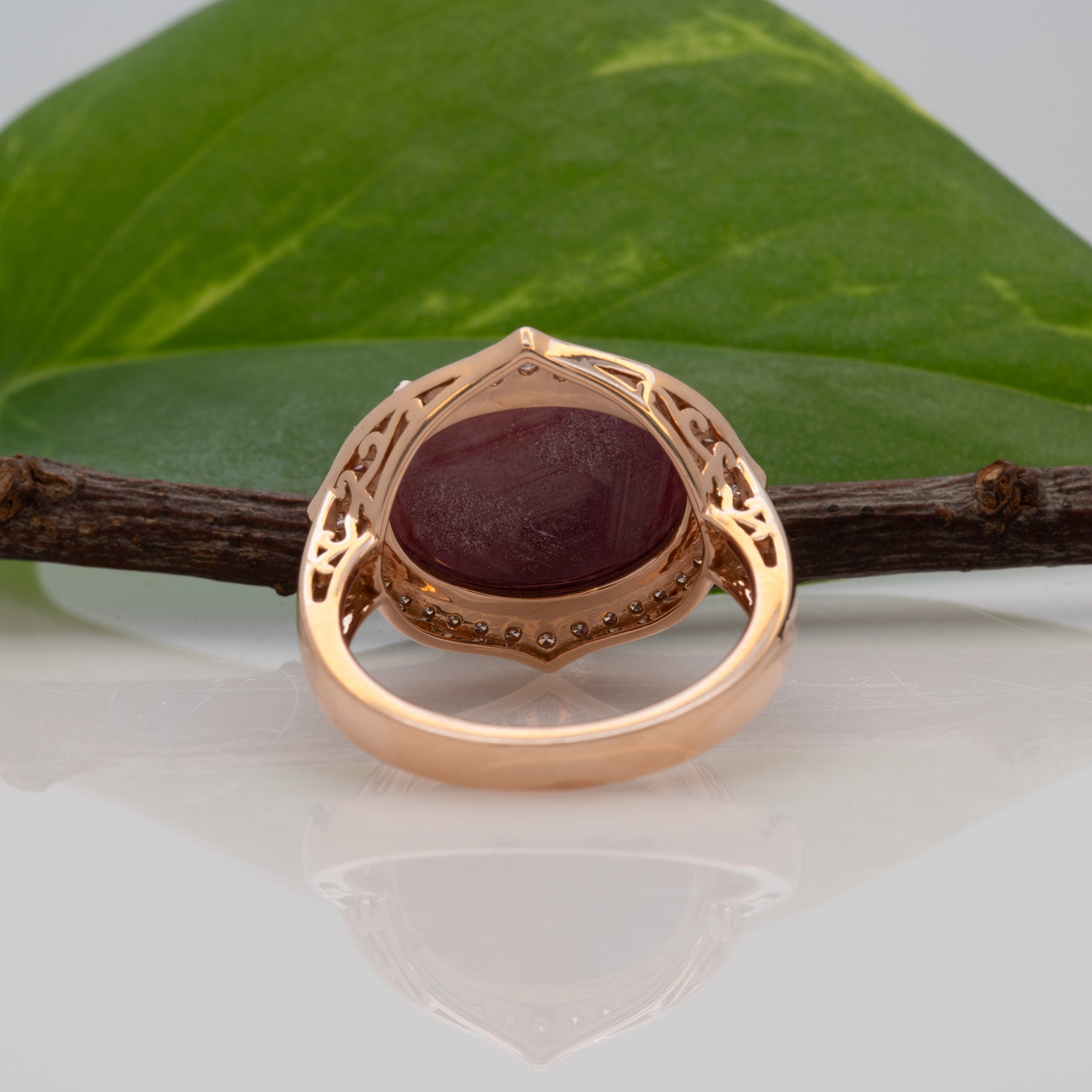 14K rose gold star ruby cabochon ring with diamond halo