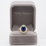 14K yellow gold GIA Ceylon sapphire cushion ring with diamond halo