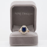 14K yellow gold GIA Ceylon sapphire cushion ring with diamond halo