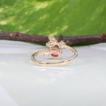14K yellow gold padparadscha sapphire ring with diamond accents