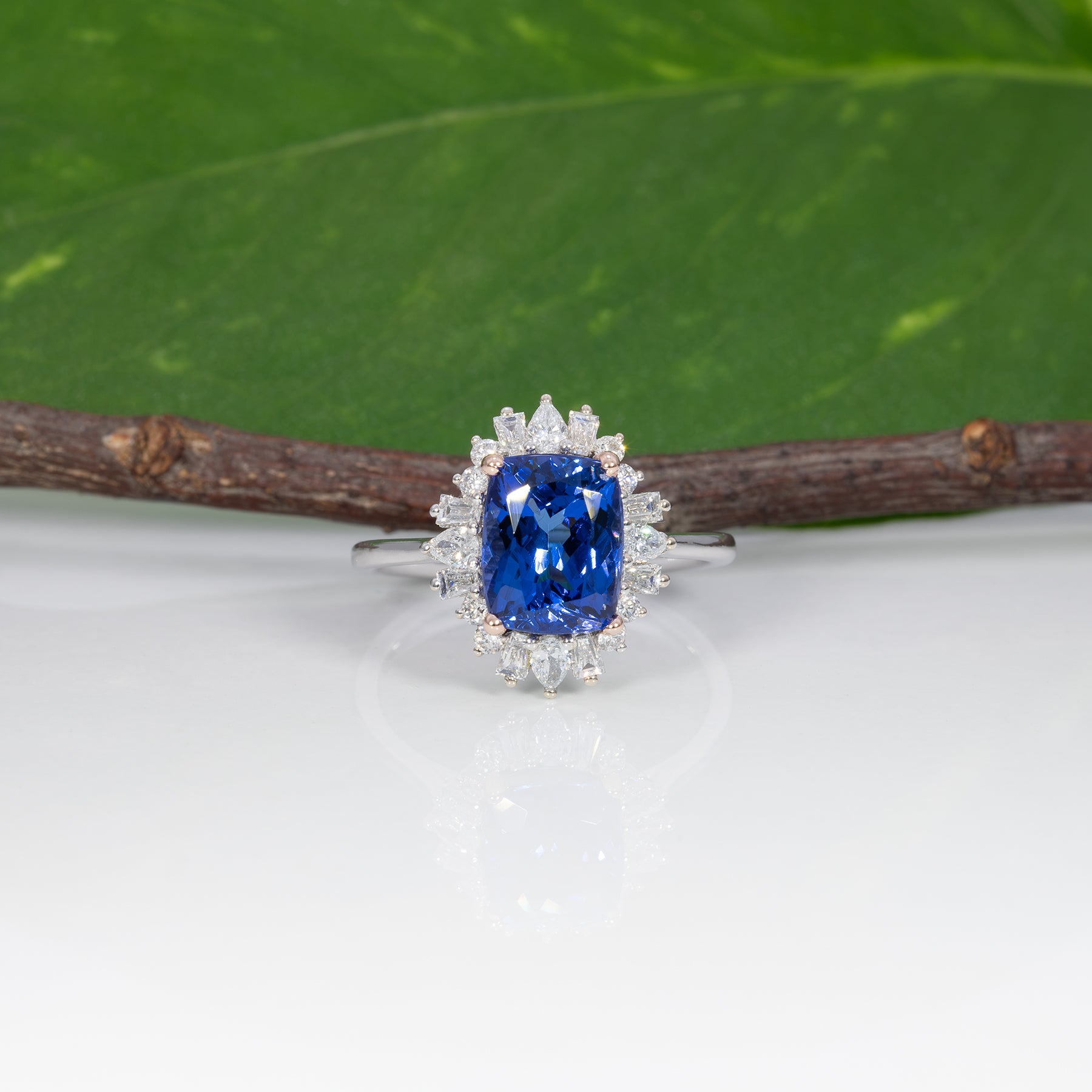 14K white and rose gold tanzanite ring with diamond accents