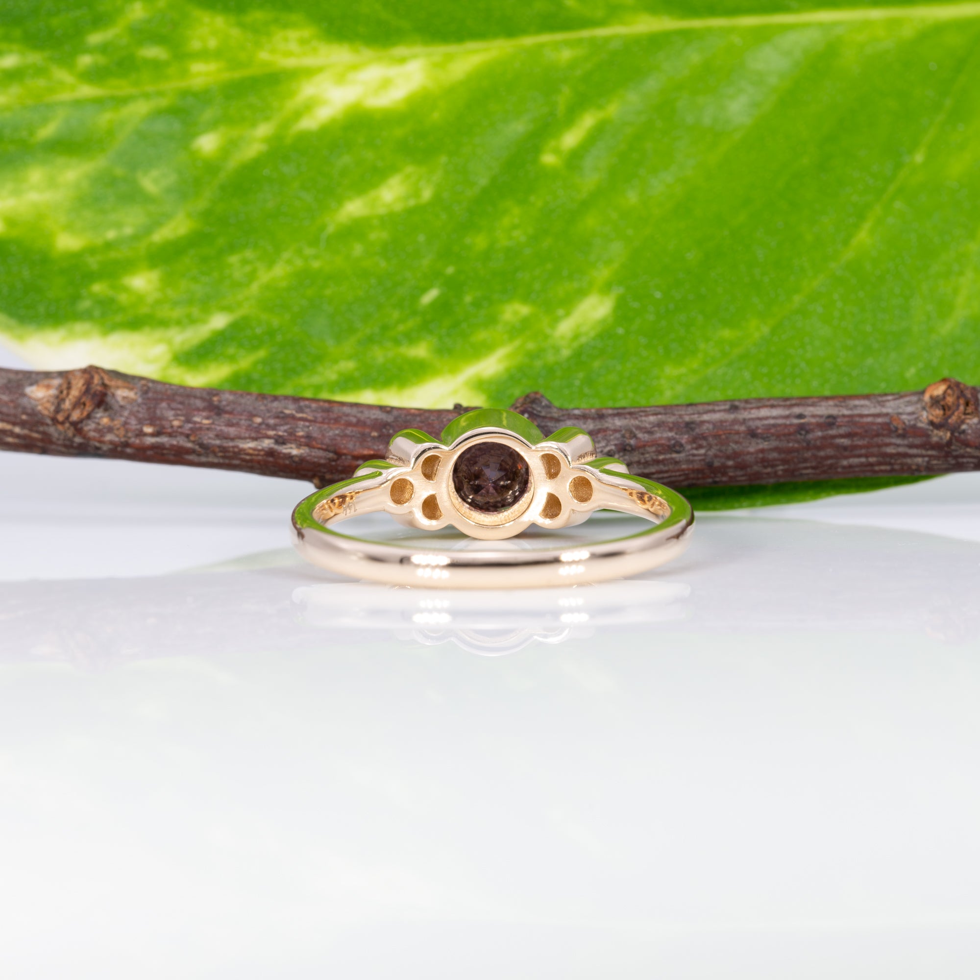 14K yellow gold bezel-set purple spinel ring with diamond accents