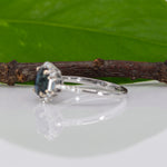14K white gold teal sapphire oval ring with diamond halo