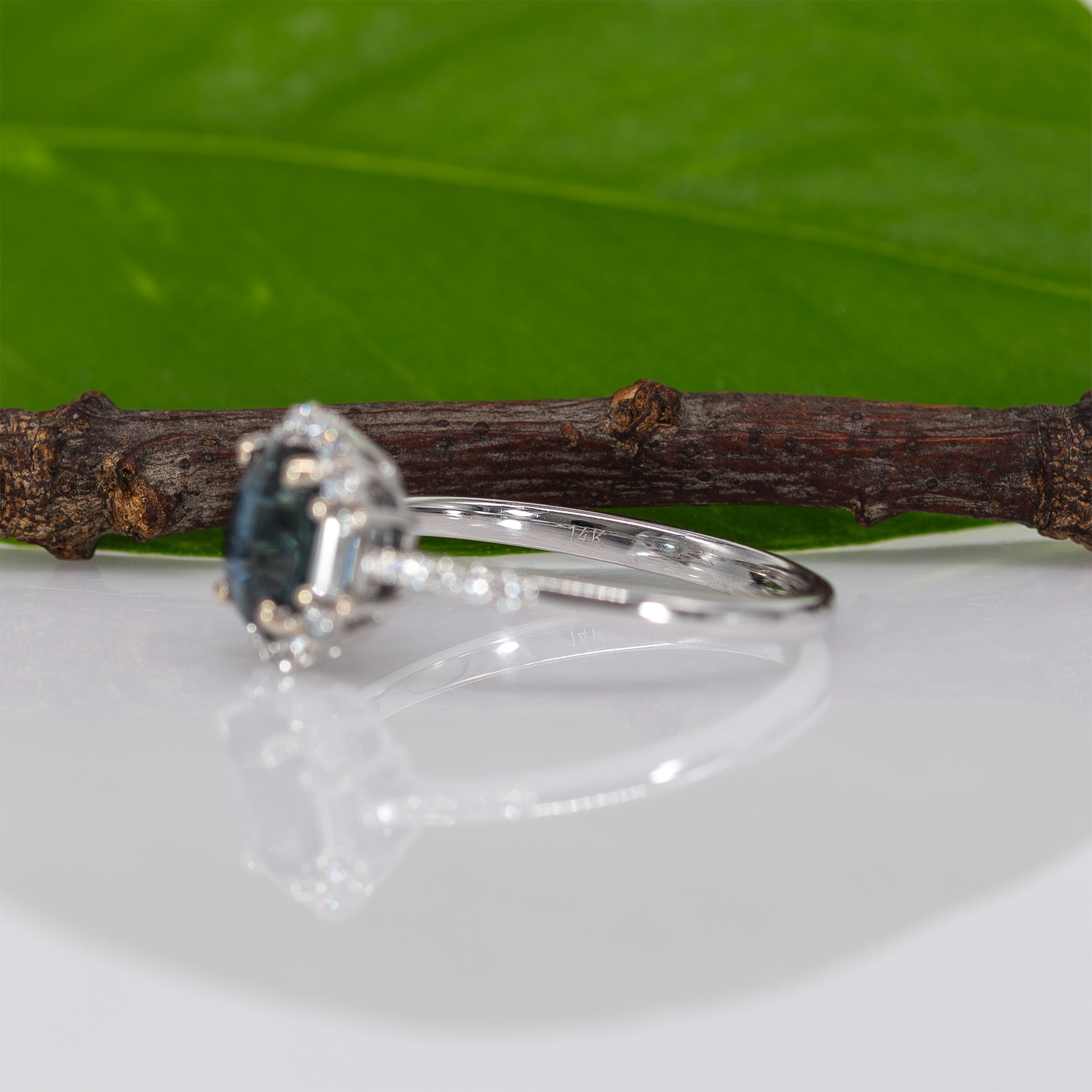 14K white gold teal sapphire oval ring with diamond halo