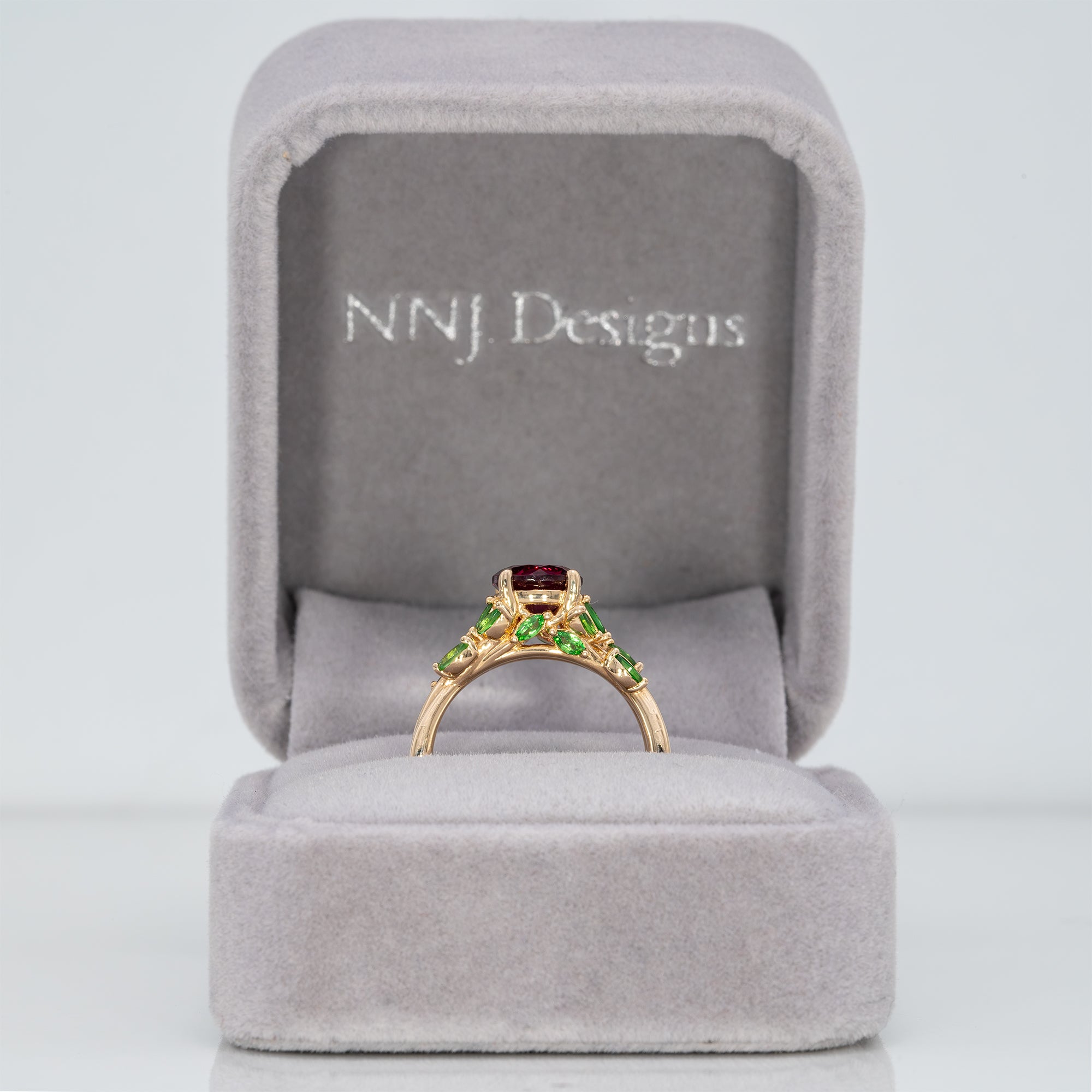 14K yellow gold purple garnet ring with tsavorite accents
