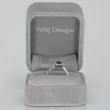 14K white gold teal sapphire oval ring with diamond halo