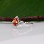 14K white gold padparadscha sapphire ring with diamond halo