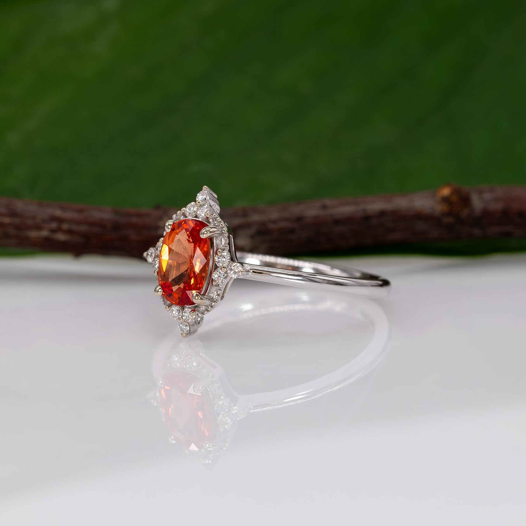 14K white gold padparadscha sapphire ring with diamond halo