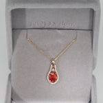 14K yellow gold padparadscha sapphire pendant