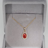 14K yellow gold padparadscha sapphire pendant