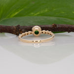14K yellow gold tsavorite garnet round ring with diamond accents